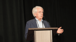 Jim Steele speaks at podium at IRE25