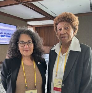 IRE's late executive director standing next to Elouise McDaniel, a retired school teacher who was sued over filing to many public records