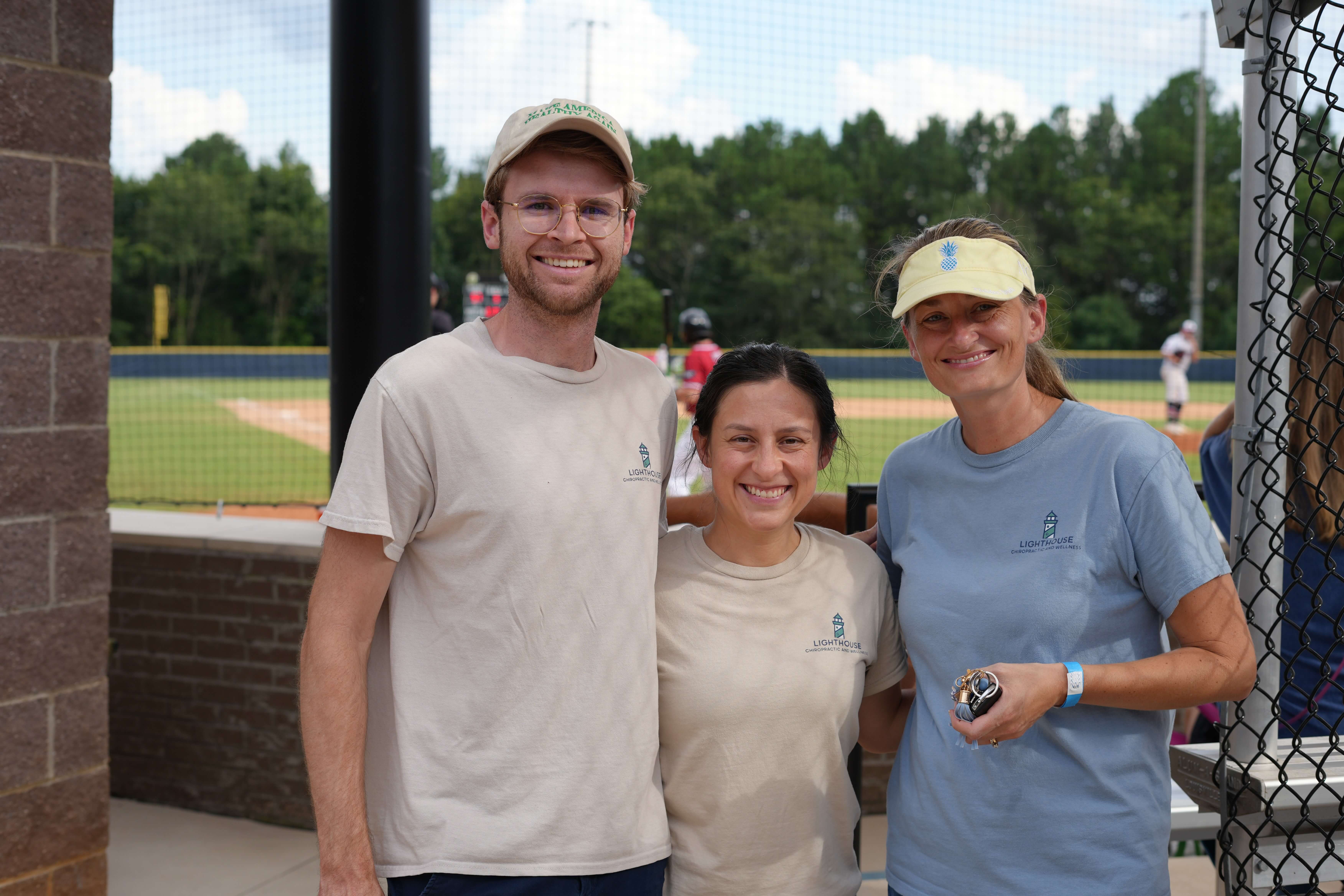 DSC01736 three people smiling outside
