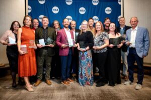 Classic Homes posing with 2025 Parade of Homes trophies