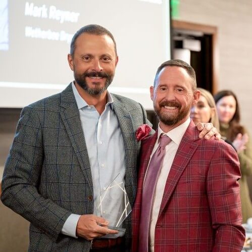 Mark Reyner with Award standing next to Loren Moreland