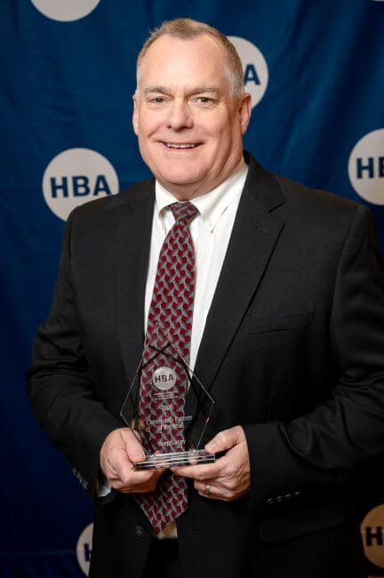 Brett Lacey with Award