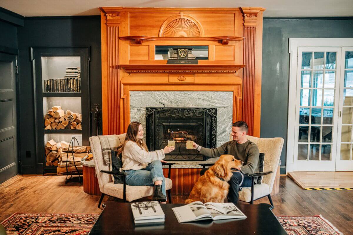 A couple enjoys beverages at the Wentworth Inn in Jackson, New Hampshire