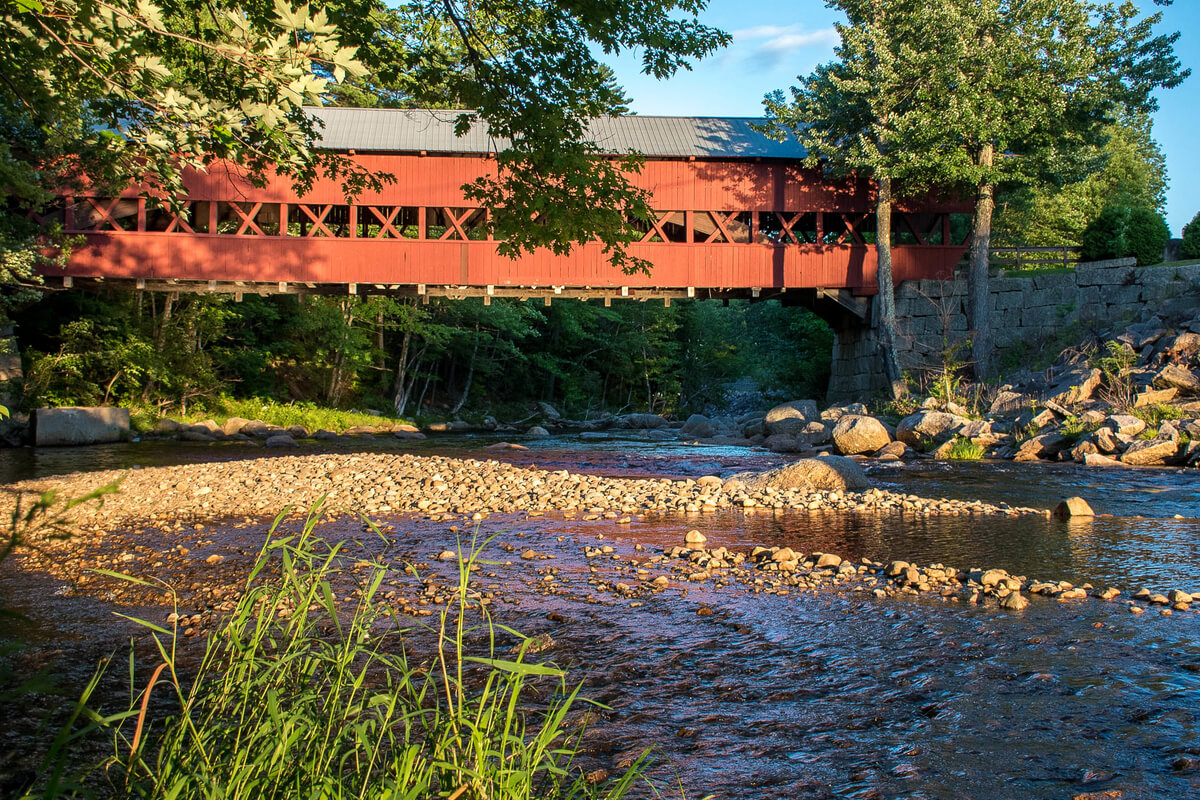 The sun shining on the Swift River Bridge,