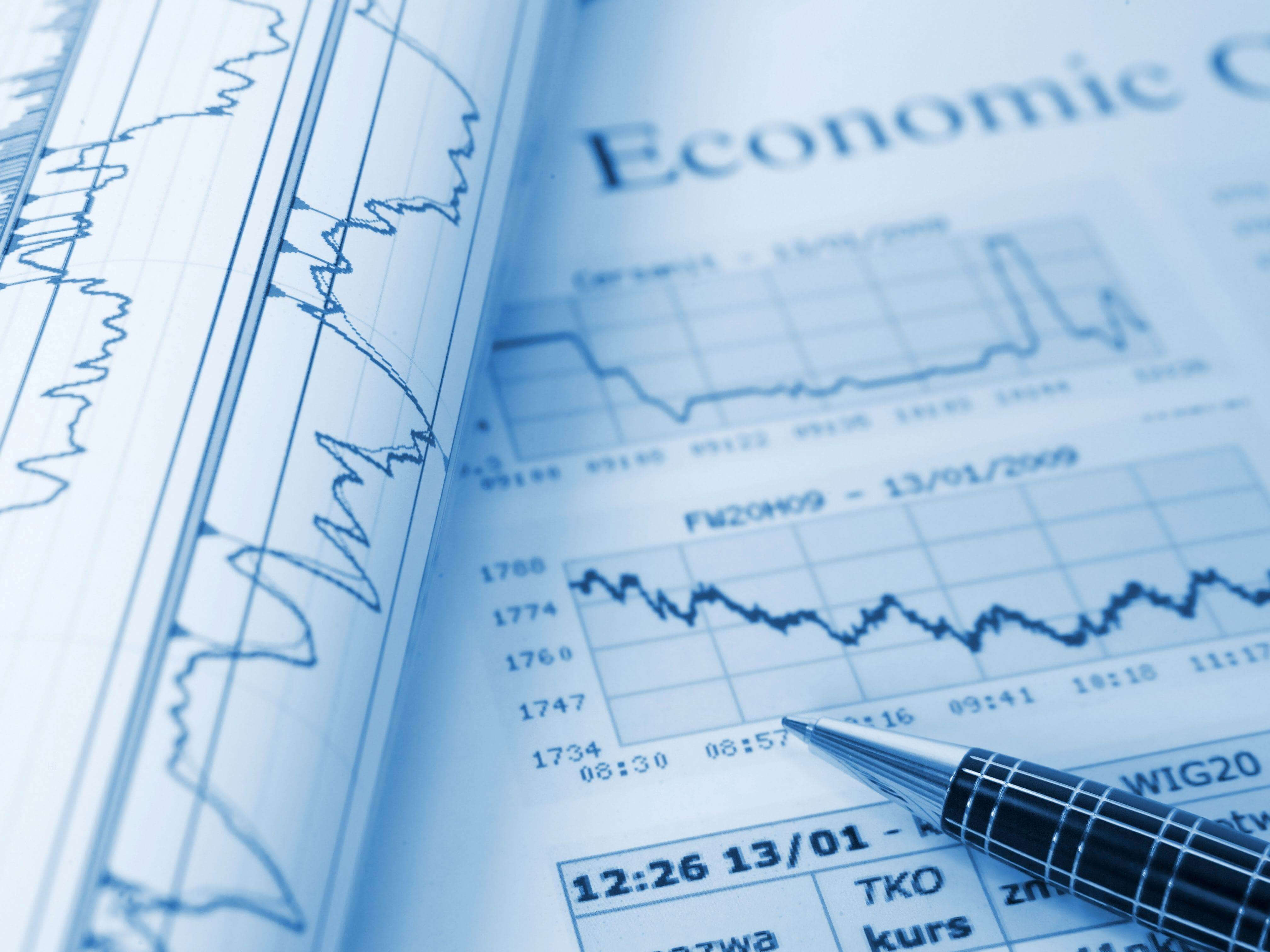 Economic Development charts and pen