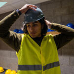 man in cim safety hat