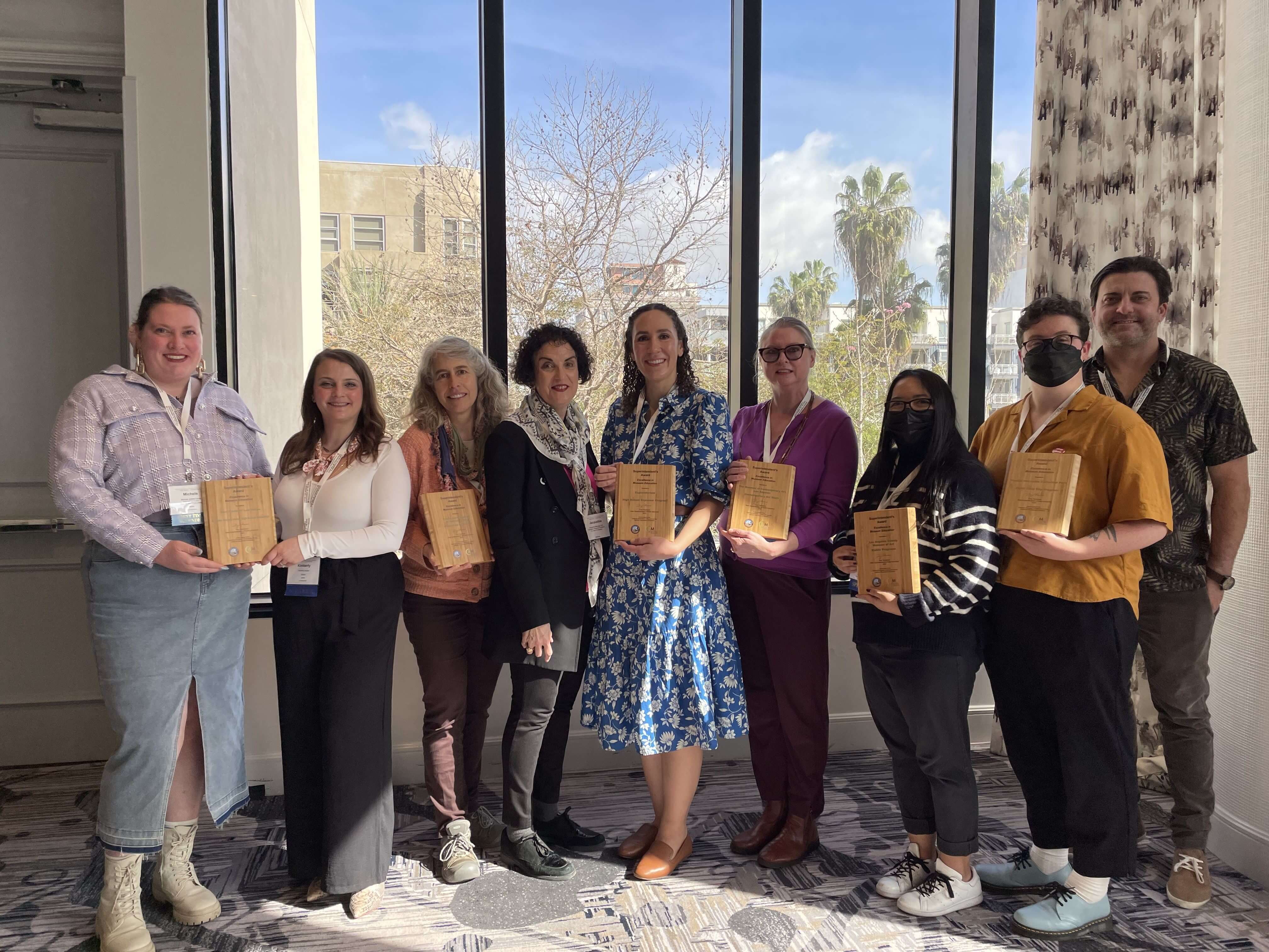 group photo holding awards