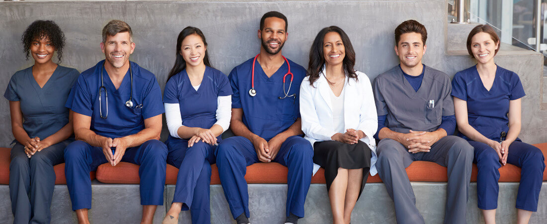 medical personnel sitting on bench