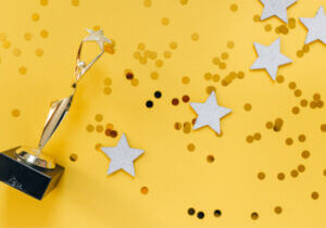 trophy, stars and confetti