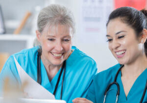 Two nurses reviewing documents