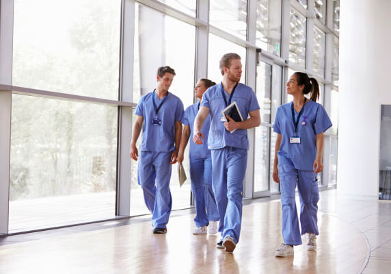 medical personnel walking and talking
