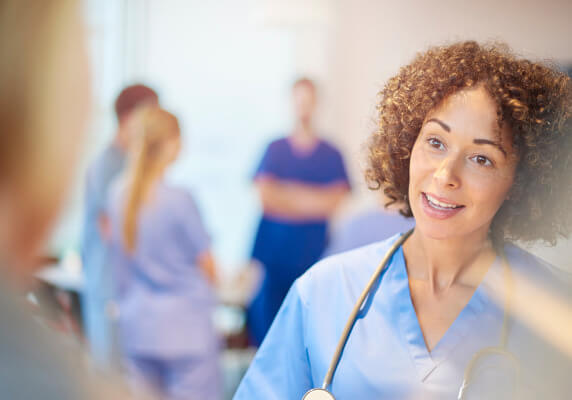 Nurse talking with colleague