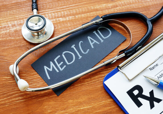 Stethoscope around Medicaid card