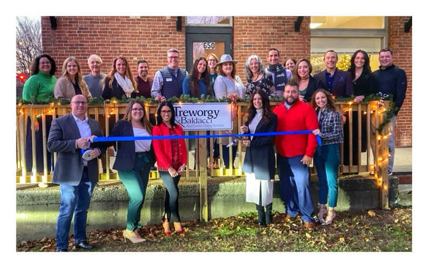 group photo ribbon cutting