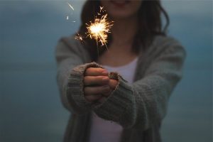 Woman holding sparkler