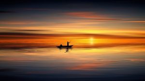 Man fishing at sunset