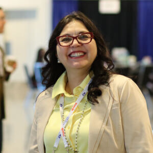 Person with glasses smiling