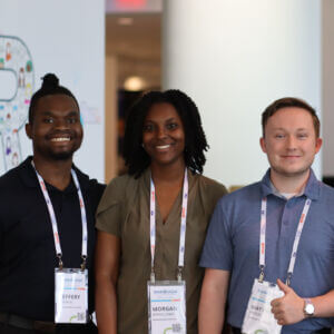 Three smiling people