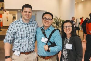 Three smiling people