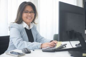 Woman Smiling with Computer
