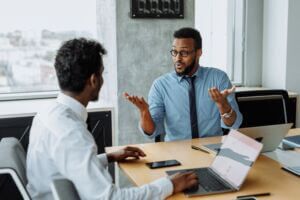 Person shrugging in conversation