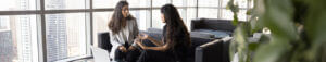 two women having a serious conversation