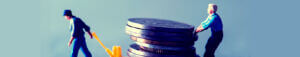 living wage pulling stack of heavy coins