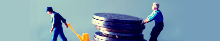 living wage pulling stack of heavy coins