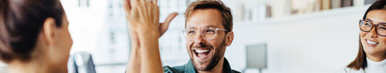 man and woman high fiving