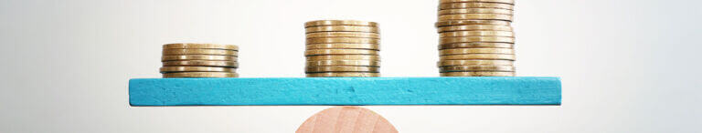 money balancing on seesaw