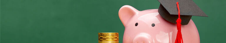 piggy bank wearing graduation hat