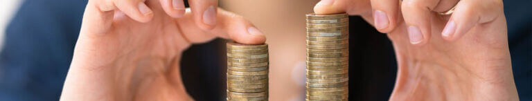 holding two stacks of coins