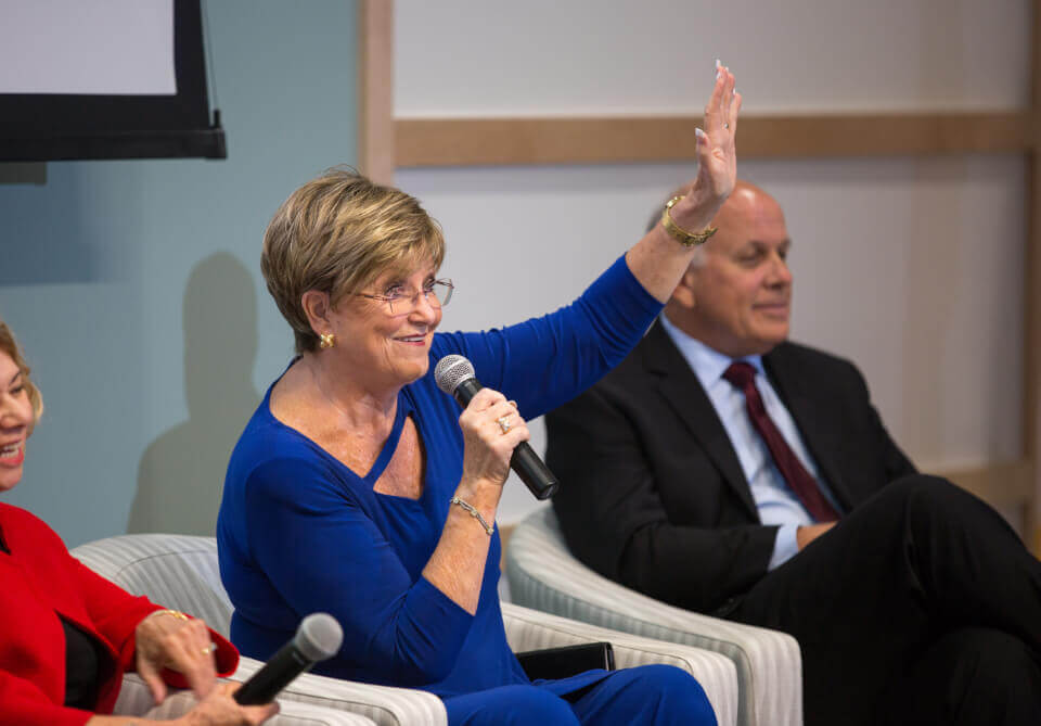 woman raising her hand