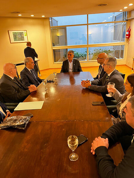 professionals seated around meeting table