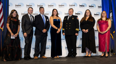 professionals on stage smiling