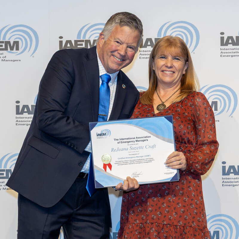 man and woman with certificate