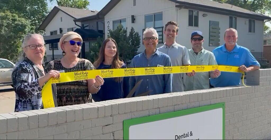 Community members celebrate ribbon cuttings for Zennity Oral Sleep Therapy and El Arka Plaza in Wheat Ridge, Colorado.