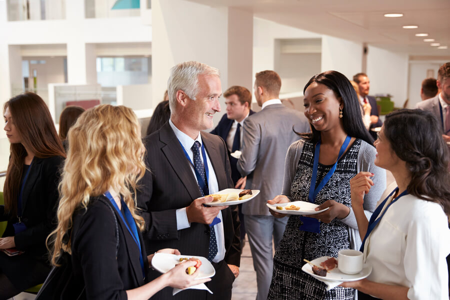 Delegates Networking During Conference Lunch Break