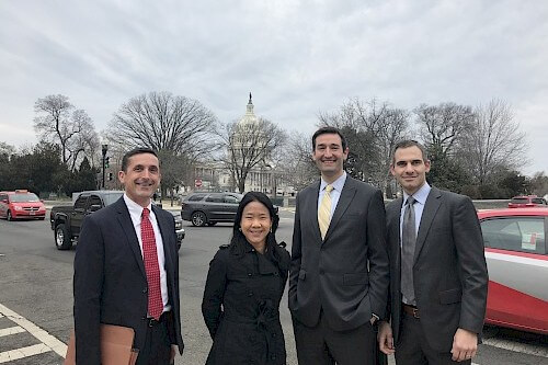 group of 4 people smiling
