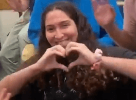 Scholarship winner Gome's Daughter and a picture from her cvideo