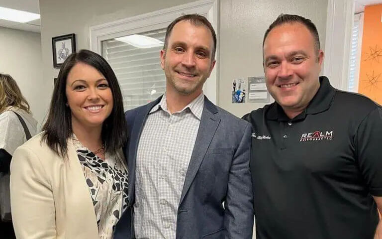 Three people making business connections