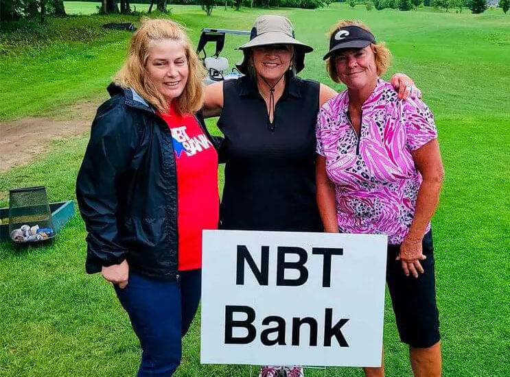 Three women at golf event