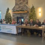 panel seated at a table