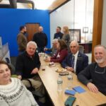 people at table smiling