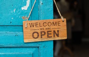 Welcome We're Open sign