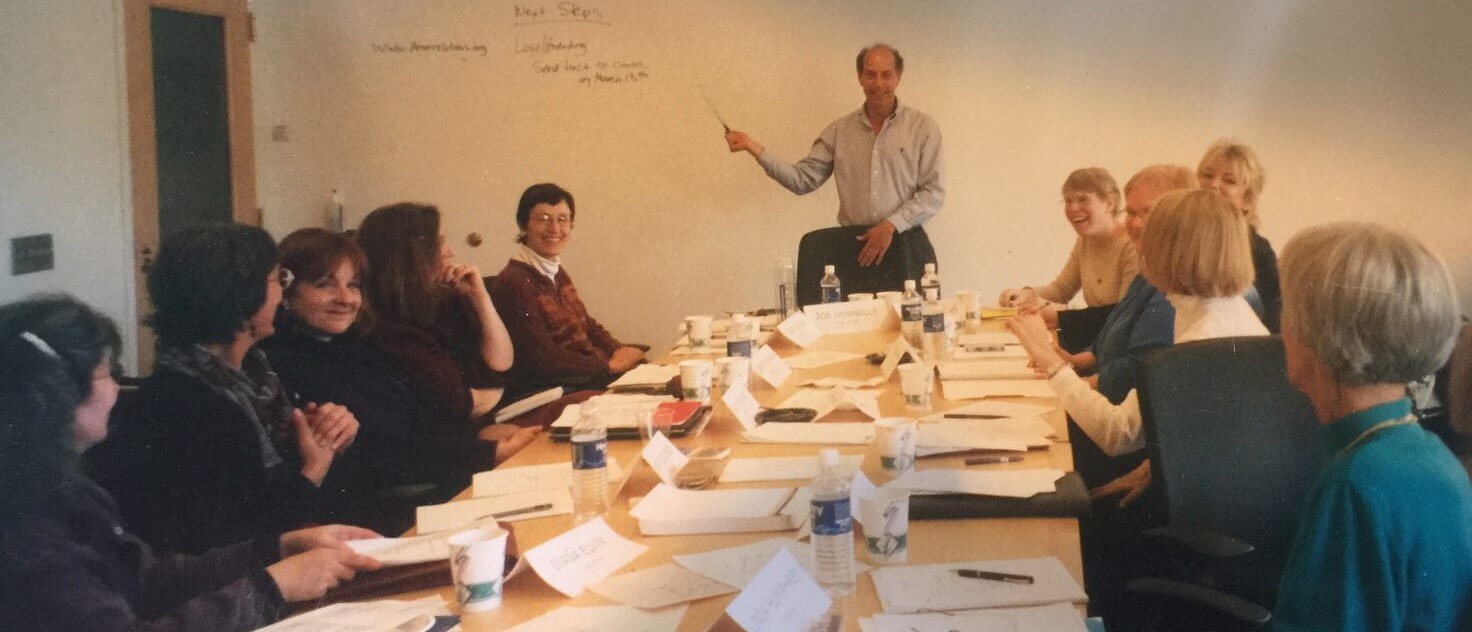 An early group gathers around a conference to meet about the Association of Donor Relations Professionals.