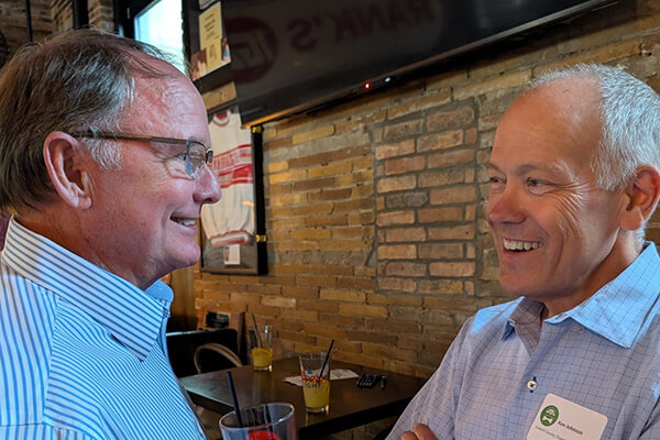 2 men talking