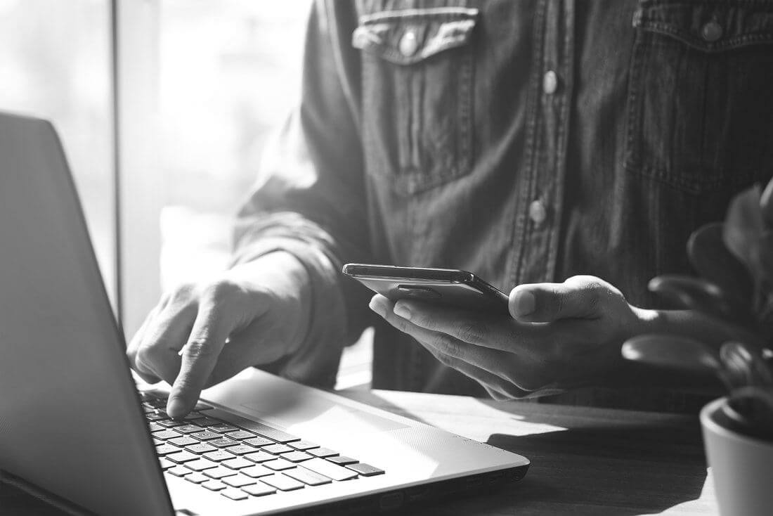 bigstock-work-using-mobile-phone-typing-412434748