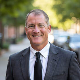 dave-headshot-2-gray-suit