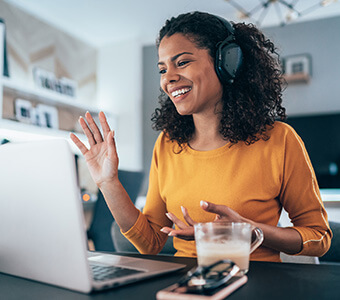 Young modern woman having Video Conference at home